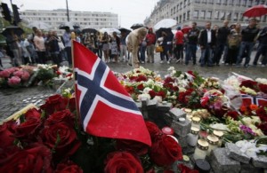136310-a-norwegian-flag-sticks-out-of-a-bunch-of-red-roses-on-the-market-squa